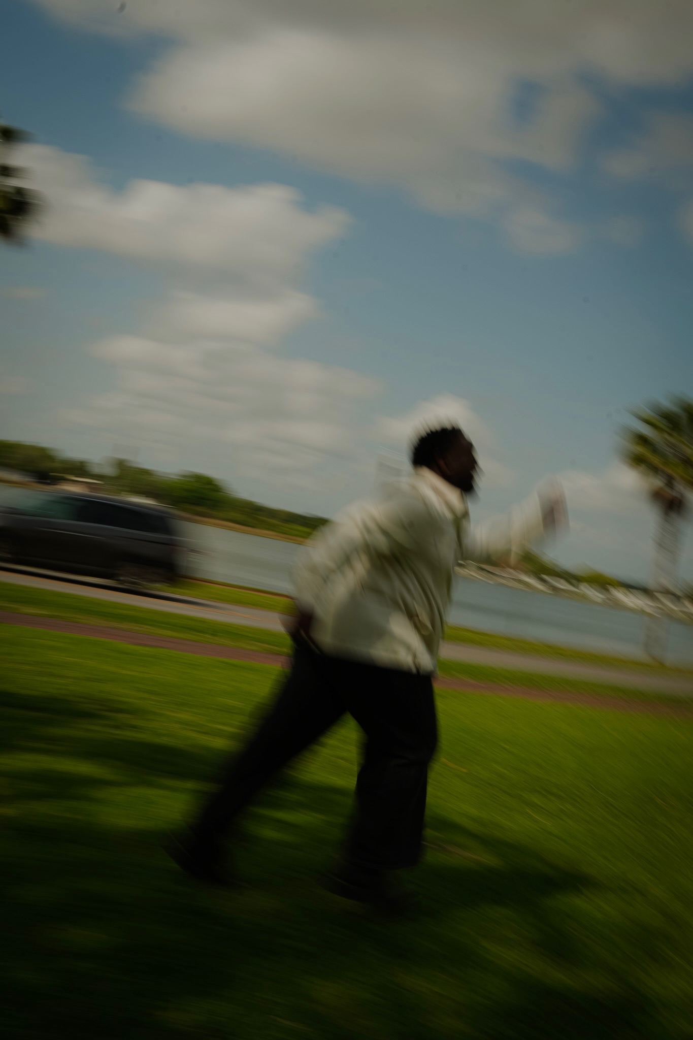 Joshua Burgess in motion by the waterfront